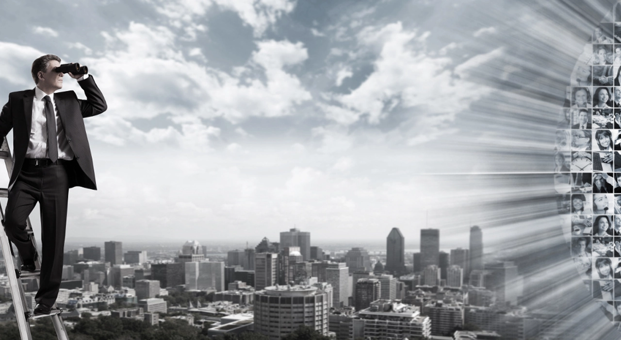 Man with binoculars representing strategic recruiting and hiring solutions