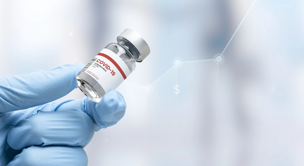 COVID-19 vaccine vial held by a doctor with infographic data subtly displayed behind