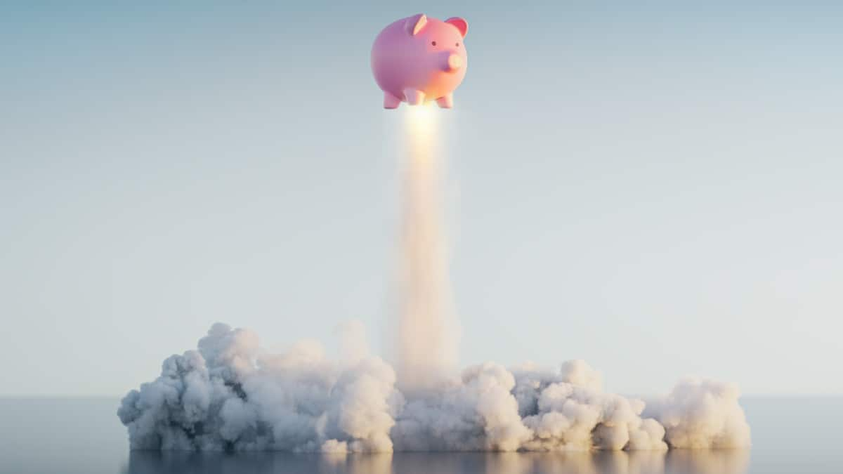 Piggy bank rising with an explosive burst of coins symbolizing financial growth and savings breakthrough